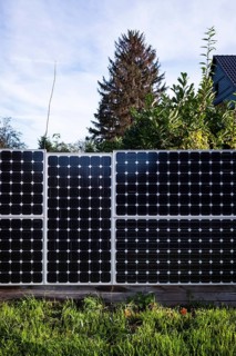 Solar panels as a garden fence and privacy screen of a house on a street in Langenfeld