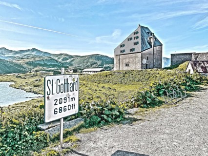 Photo with reduced dynamics saturation HDR of view to the left at the edge of the picture mountain lake in the foreground sign for pass Sankt St Gotthard Gotthard pass 2091 metres altitude high mounta...