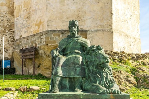 The monument to King Sancho IV El Bravo in front of Guzman Castle in Tarifa