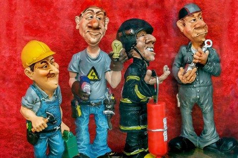 Shop window with funny ceramic figures of different professions