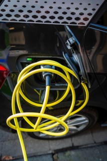 An e-car charges at a public charging station in Duesseldorf