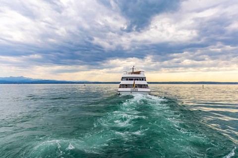 Lake Constance in the evening with the excursion boat Graf Zeppelin