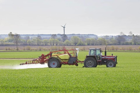 Farmer spraying pesticides