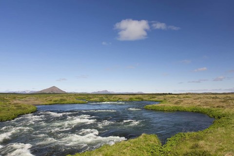 The effluent river Laxa in summer