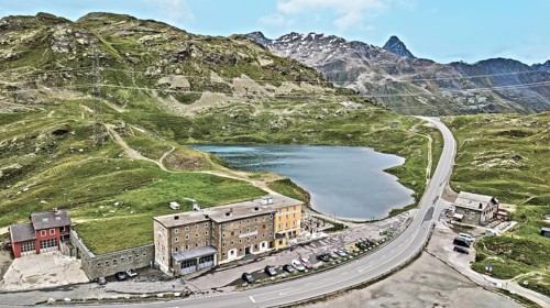 Photo with reduced dynamics saturation HDR of mountain lake at mountain pass alpine mountain road alpine road pass road Bernina Pass Bernina Pass