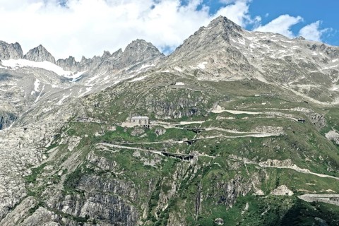 Photo with reduced dynamics saturation HDR of mountain pass alpine mountain road alpine road pass road pass Furkapass with serpentines