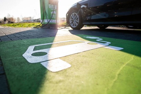 An e-car charges at a public charging station in Duesseldorf