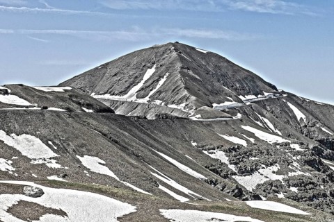Photo with reduced dynamic saturation HDR of mountain pass alpine mountain road alpine road pass road pass view of highest asphalted alpine road ring road around Cime de la Bonette Col de la Bonette i...