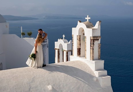 Taking wedding photos atop the roof of Chapel of St John the Baptist