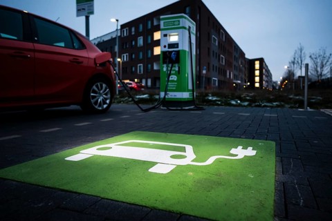 An e-car charges at a public charging station in Duesseldorf