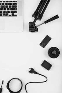 Overhead view camera accessory with laptop white background