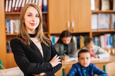 Female teacher blurred background classroom