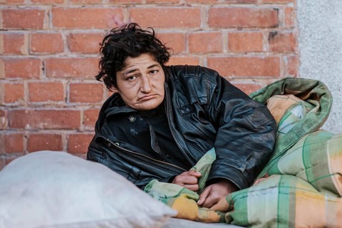 Homeless woman blanket outdoors