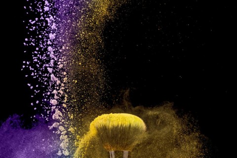 Makeup brush dust powder dark background