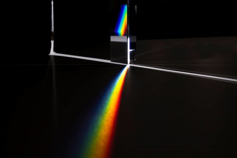 Prism dispersing light concept