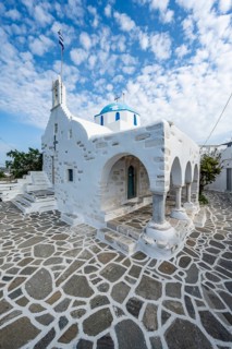 White Greek Orthodox Church Holy Church of Agios Konstantinos with Greek flag