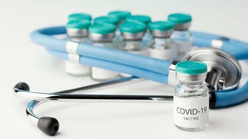 Assortment with coronavirus vaccine bottle