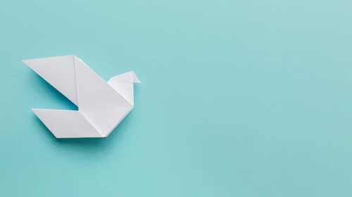 Flat lay paper dove with copy space