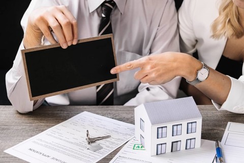 Real estate agent with client meeting