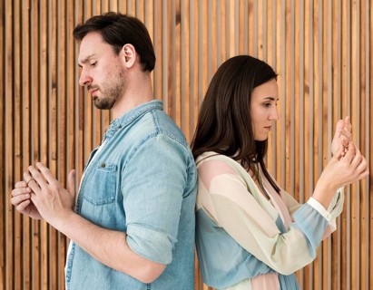 Adult man woman taking wedding rings off