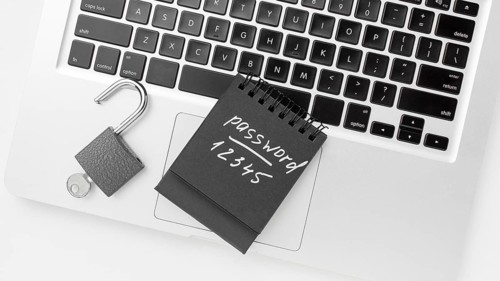 Flat lay laptop with lock key