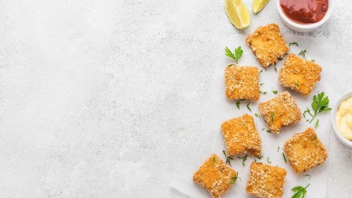 Top view fried chicken nuggets with sauces copy space