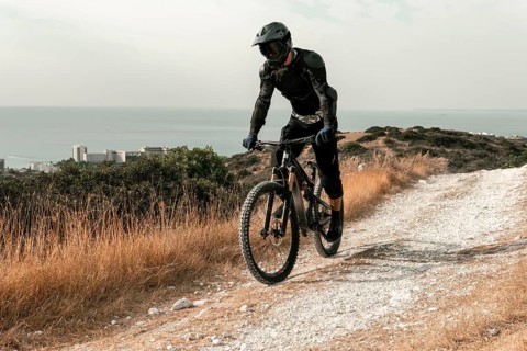 Man mountain biking equipment riding his bike
