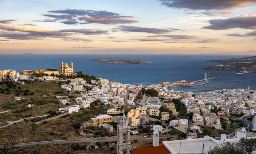 View of the town of Ermoupoli with Anastasi Church or Church of the Resurrection at sunset