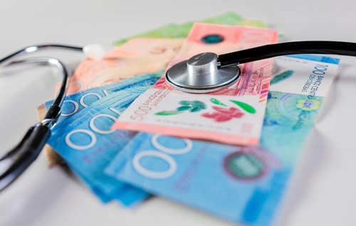 Stethoscope on Nicaraguan banknote isolated. Nicaraguan healthcare cost concept. Stethoscope on Nicaraguan banknotes on white background