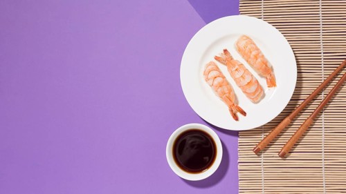 Top view delicious sushi with soy sauce table