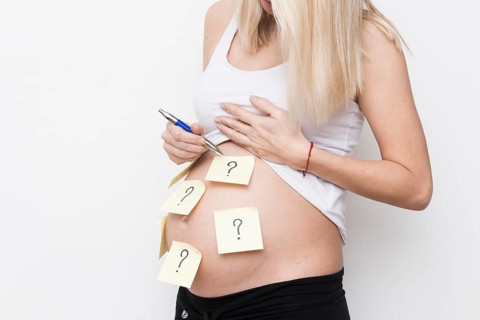 Pregnant woman with sticky notes