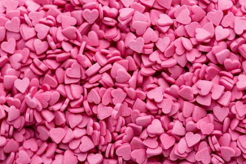Top view heart shaped pink sweets