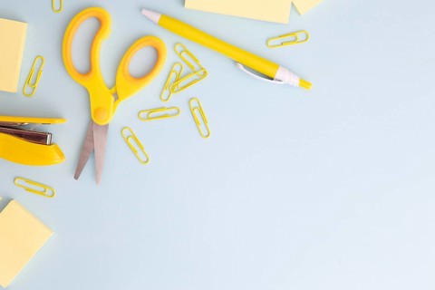 Flat lay stationary arrangement blue background with copy space