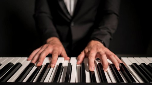 Close up front view professional keyboard player