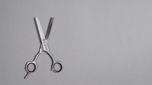 High angle view scissors grey background