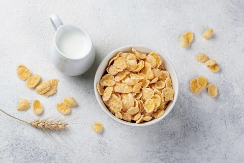 Top view corn flakes breakfast with milk wheat