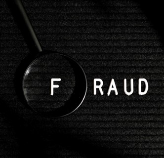Fraud word with letter magnifying glass top view