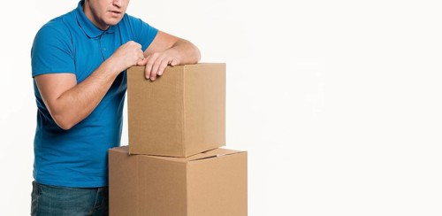 Front view delivery man cardboard boxes