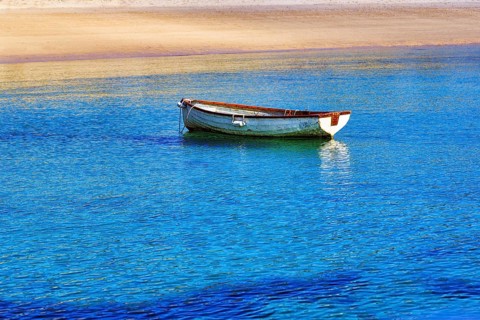 White rowboat on the shore