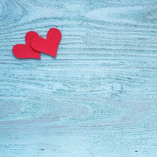 Two red hearts wooden table