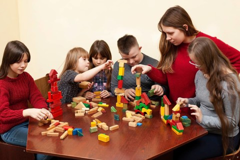 Children with down syndrome playing with toys