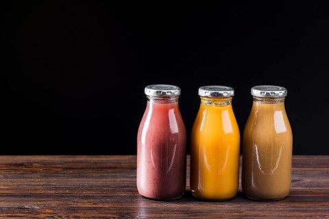 Smoothie bottles wooden surface