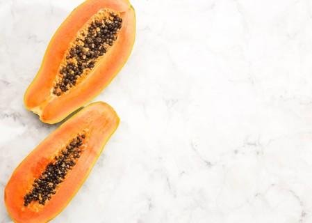 Halves papaya fruit with copy space