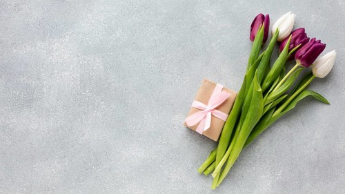 Bouquet tulips with wrapped gift copy space