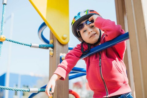 Kid playing outside playground