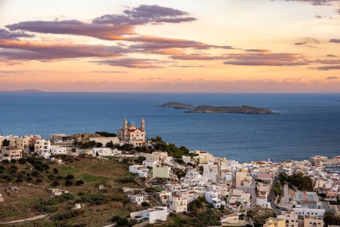 View of the town of Ermoupoli with Anastasi Church or Church of the Resurrection at sunset