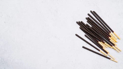 Biscuit sticks chocolate white backdrop