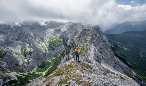 Mountaineer at the summit of the Waxenstein