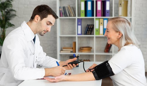 Medium shot doctor taking blood pressure