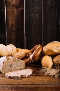 Freshly baked bread wooden textured background